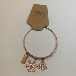 Handmade rose gold stainless steel bracelet with 3 charms.
